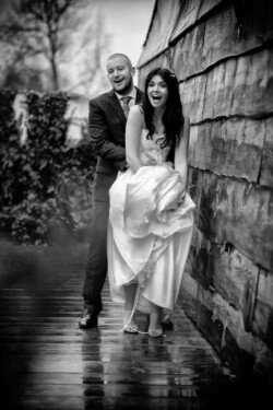 Candid wedding photography Bath: a man and a woman standing next to each other.