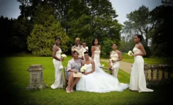 www.thefxworks.co.uk A bride and her bridesmaids posing in elegant dresses at Orchardleigh House Weddings in a garden setting.
