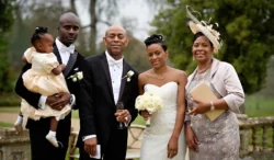 www.thefxworks.co.uk A family dressed in formal attire at an Orchardleigh House wedding, with the bride and groom at the center.