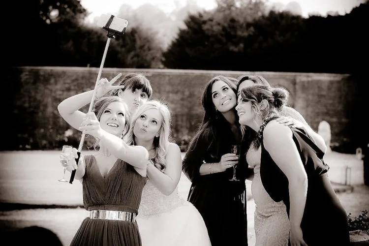 www.thefxworks.co.uk A group of bridesmaids at Farleigh House taking a selfie.