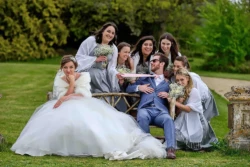 A group of people posing for a photo during a Farleigh House wedding.