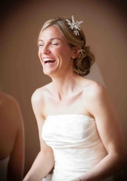 A bride laughs as she gets ready for her wedding at St. Andrie's park.