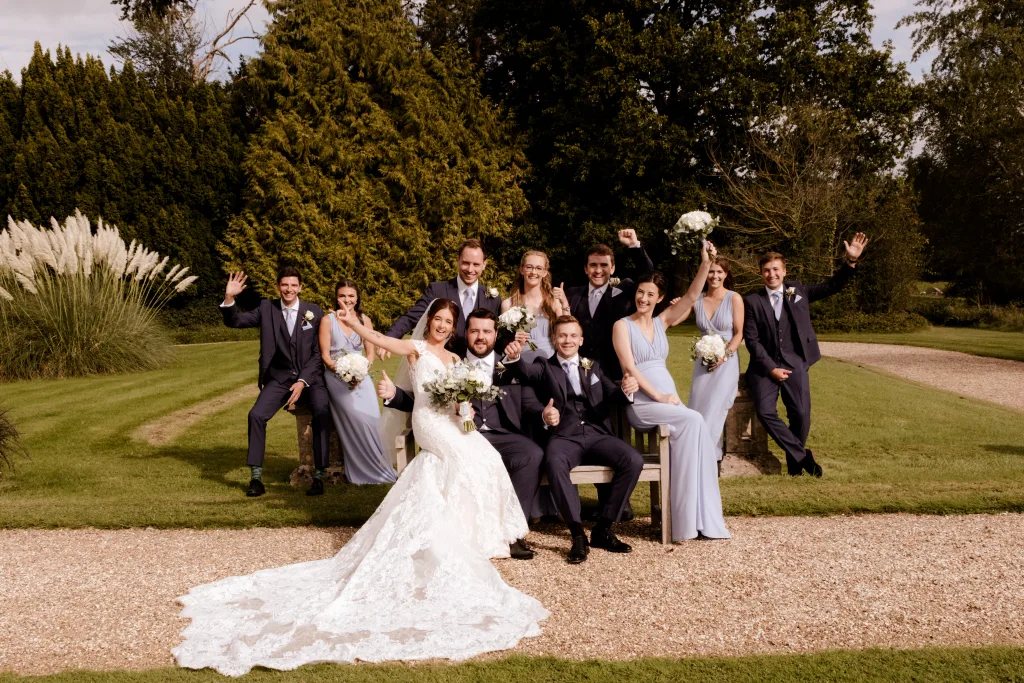 A group of bridesmaids and groomsmen pose for a photo. Orchardleigh Estate weddings